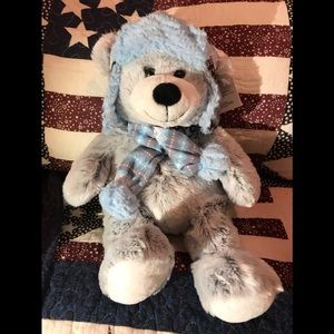 Cute stuffed bear in winter outfit